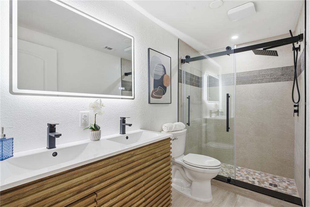 613 Highview Circle North Brandon, FL 33510 - Photo 23 of 37 a bathroom with a sink a toilet and shower