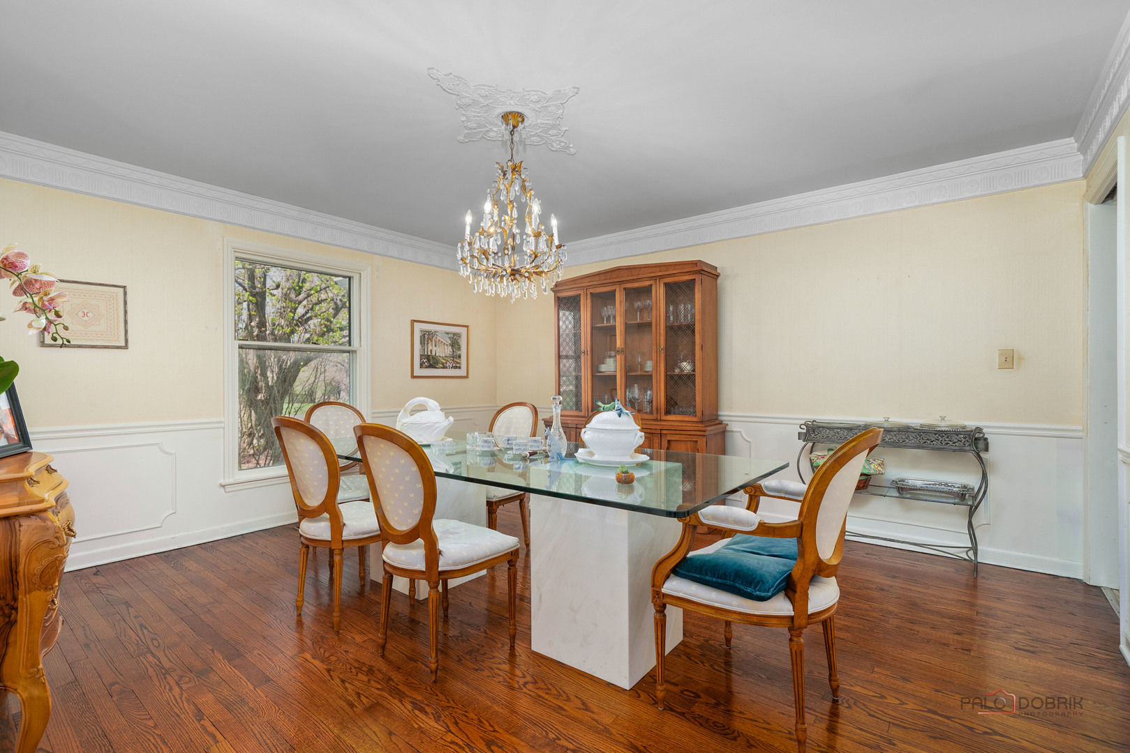 37 Forest Hills Road Lake Bluff, IL 60044 - Photo 9 of 52 a view of a dining room with furniture a chandelier and wooden floor