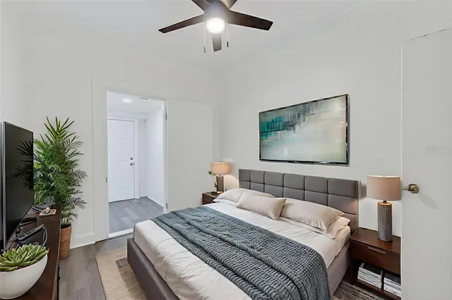 a view of an empty room with wooden floor