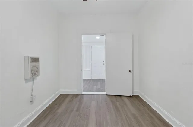 a bedroom with a bed and a potted plant