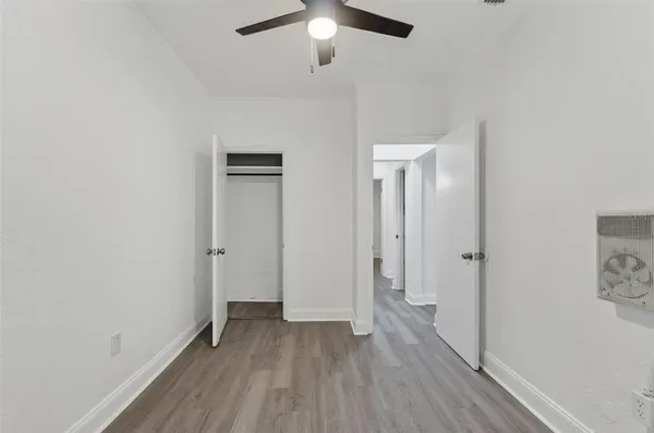 a kitchen with white cabinets and a stove