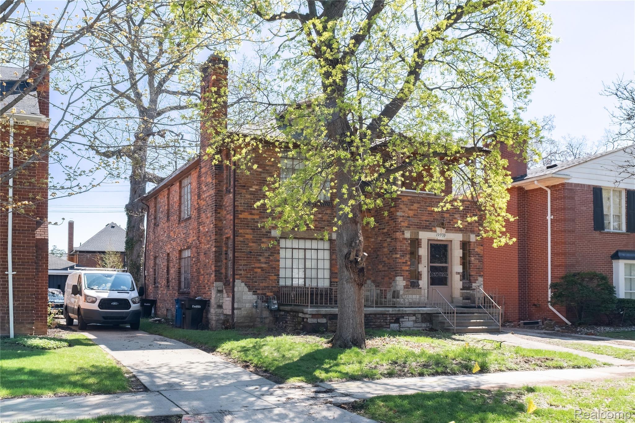 19970 Stratford Road Detroit, MI 48221 - Photo 23 of 27 View of front of home featuring a chimney and brick siding