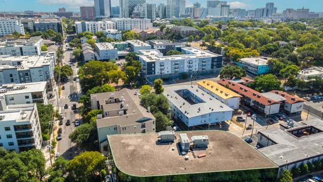 an aerial view of residential houses with outdoor space