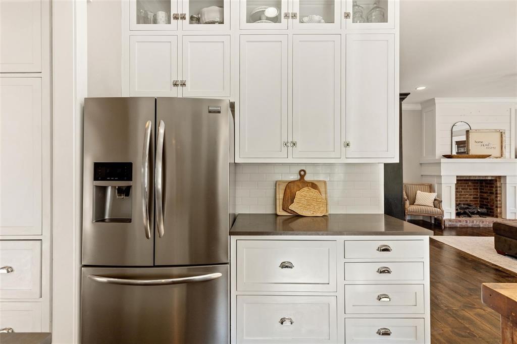 1109 East Oakdale Road Irving, TX 75060 - Photo 6 of 33 a kitchen with appliances a refrigerator and cabinets