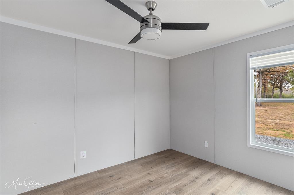 607 Nettleton Drive Princeton, LA 71067 - Photo 11 of 16 a view of an empty room with wooden floor and a window