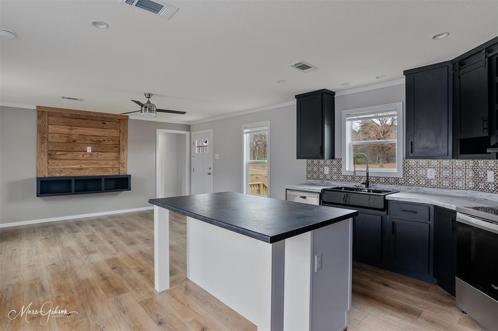 607 Nettleton Drive Princeton, LA 71067 - Photo 2 of 16 a kitchen with stainless steel appliances granite countertop a sink stove and refrigerator