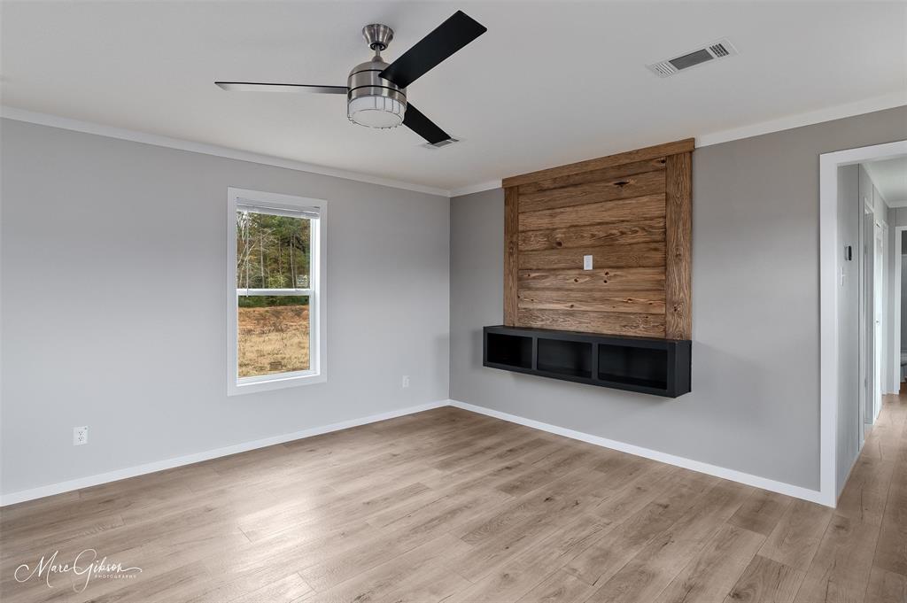 607 Nettleton Drive Princeton, LA 71067 - Photo 6 of 16 a view of an empty room with a window and kitchen view