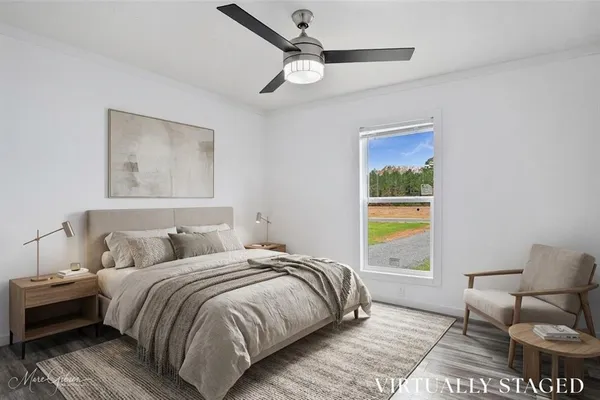 a bedroom with bed and a window