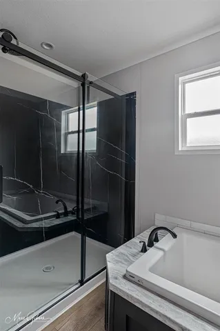 a bathroom with a sink and mirror