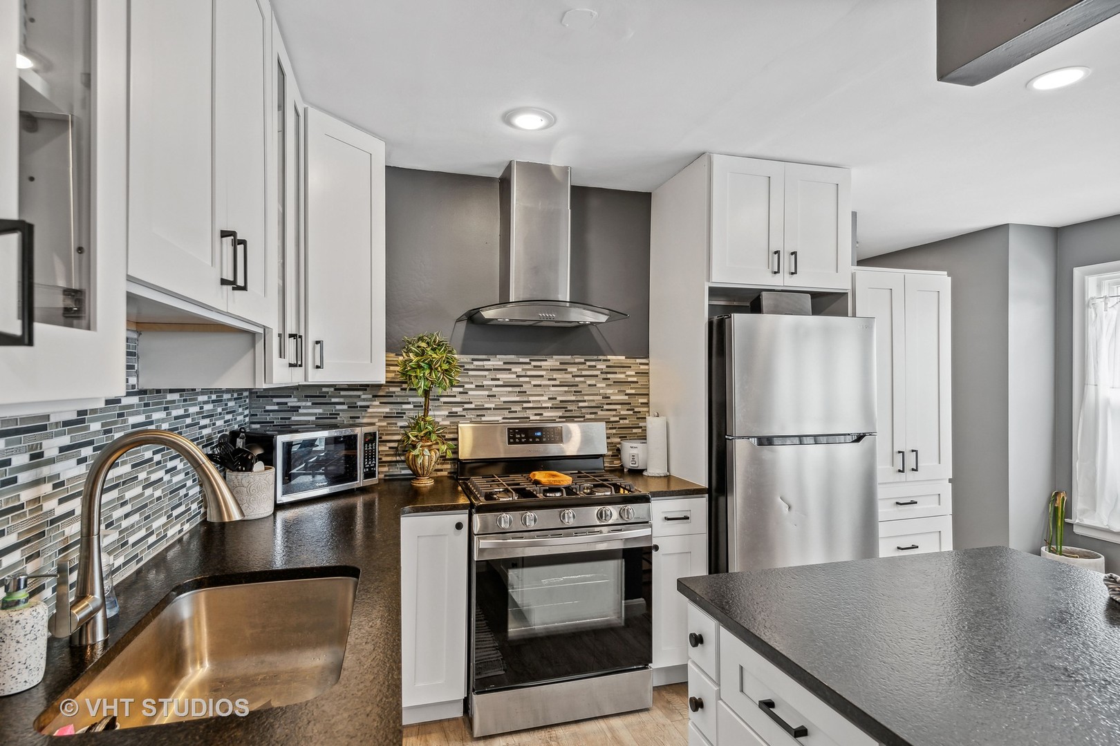 7221 Division Street, Unit 1 River Forest, IL 60305 - Photo 5 of 15 a kitchen with stainless steel appliances granite countertop a stove a refrigerator and a sink