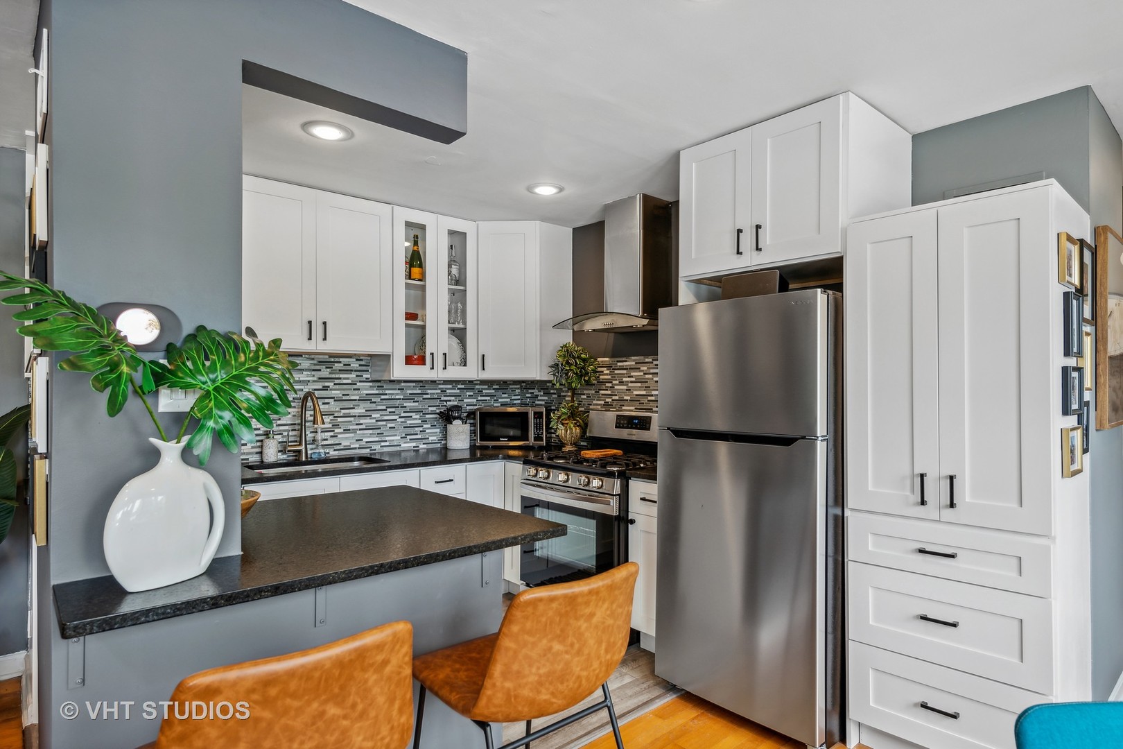 7221 Division Street, Unit 1 River Forest, IL 60305 - Photo 7 of 15 a kitchen with stainless steel appliances granite countertop a refrigerator and a stove