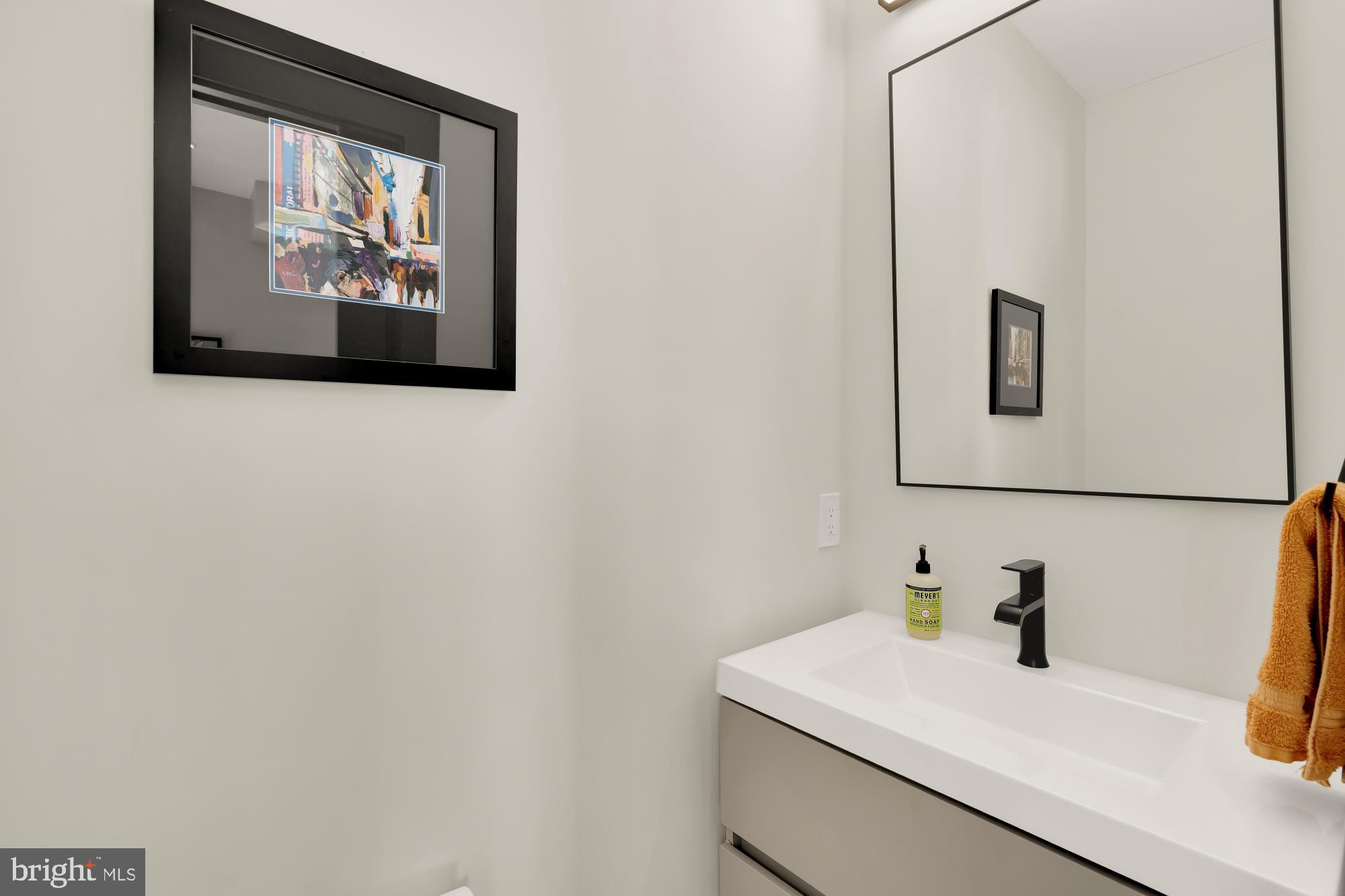 47 T Street Northeast Washington, DC 20002 - Photo 17 of 45 a bathroom with a sink and a mirror