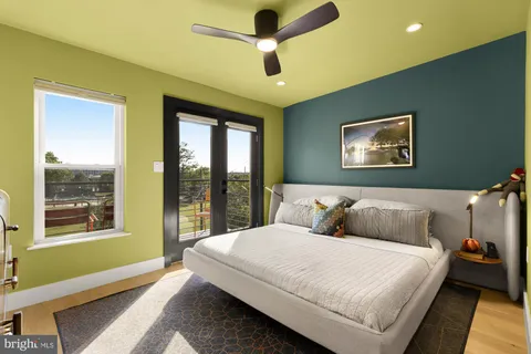 a bedroom with a bed and a television