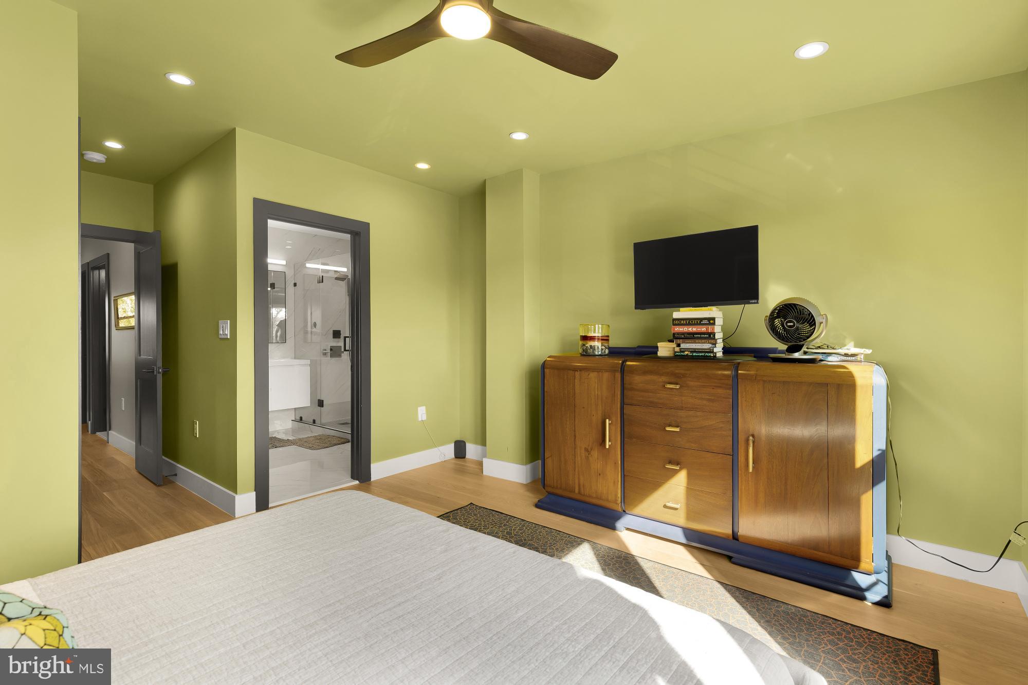 47 T Street Northeast Washington, DC 20002 - Photo 31 of 45 a bedroom with a bed and a television