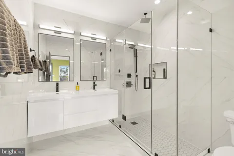 a bedroom with a bed and washer