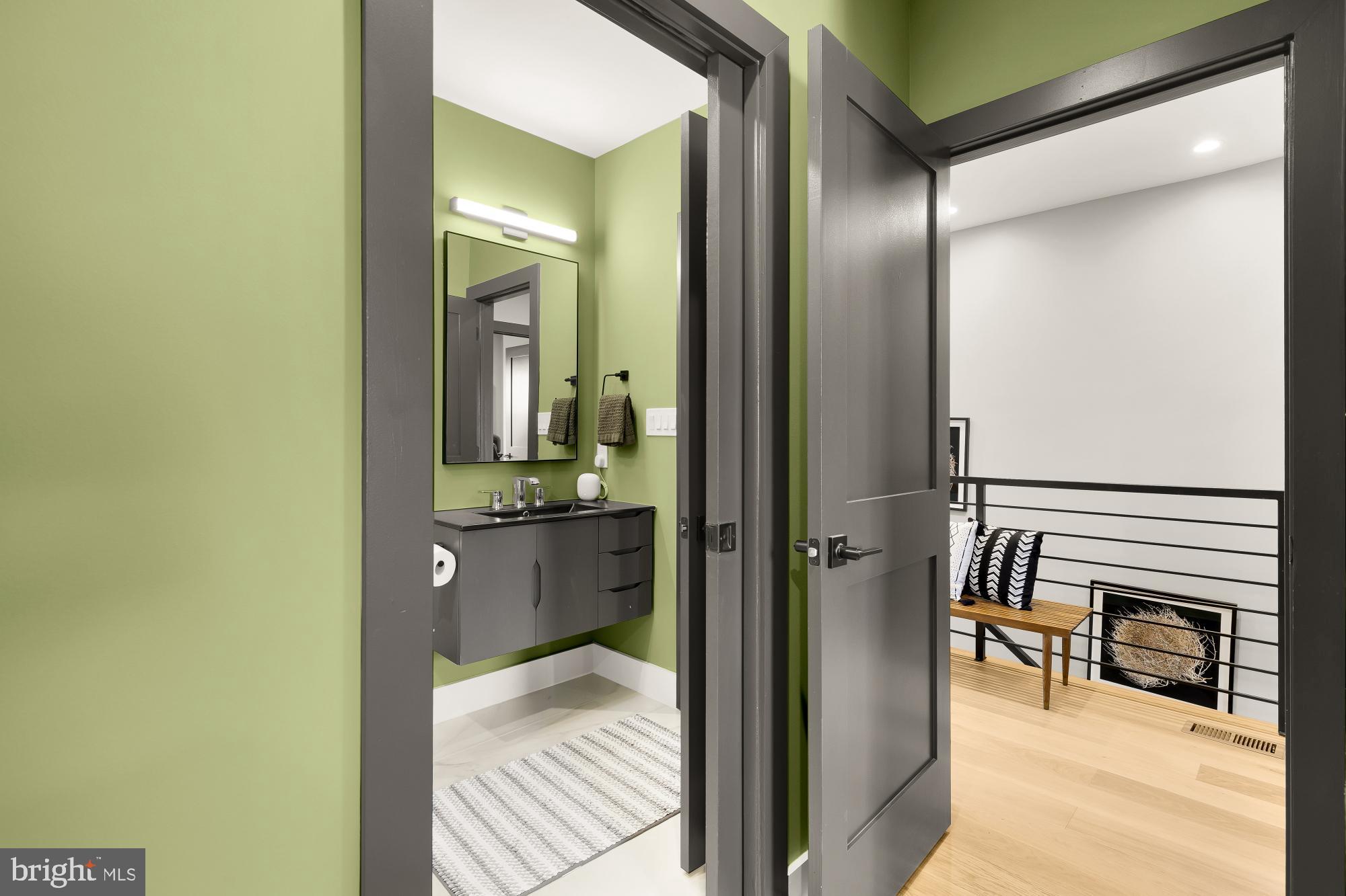 47 T Street Northeast Washington, DC 20002 - Photo 34 of 45 a bathroom with a mirror and a sink