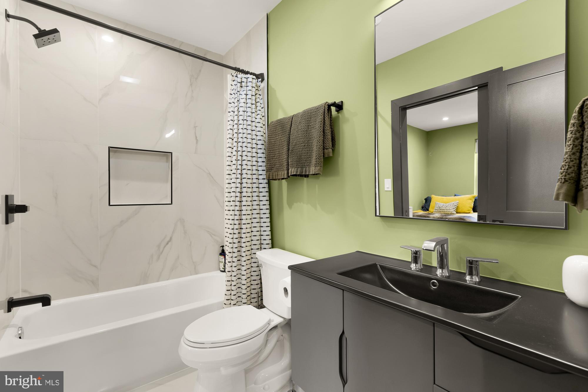 47 T Street Northeast Washington, DC 20002 - Photo 35 of 45 a bathroom with a granite countertop sink and a mirror