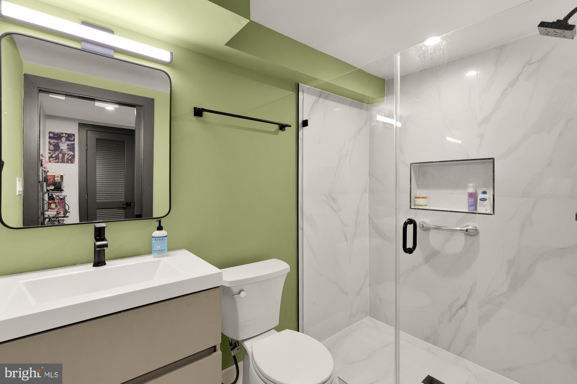 47 T Street Northeast Washington, DC 20002 - Photo 43 of 45 a bathroom with a sink a toilet and shower