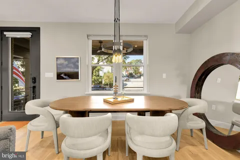 a dining room with furniture and window