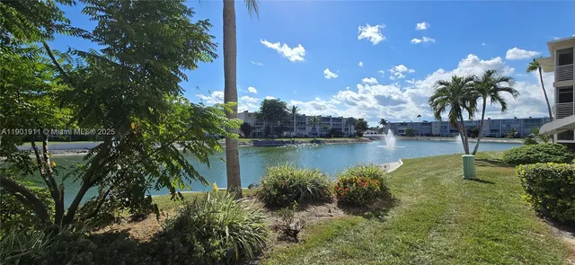 a view of a lake with a house in the background