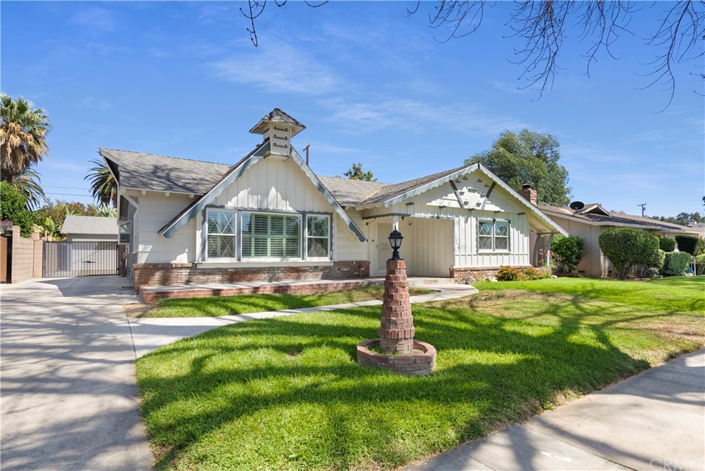 5246 Brighton Drive Riverside, CA 92504 - Photo 1 of 1 a front view of a house with a yard table and chairs
