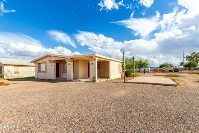 a view of a house with basketball court