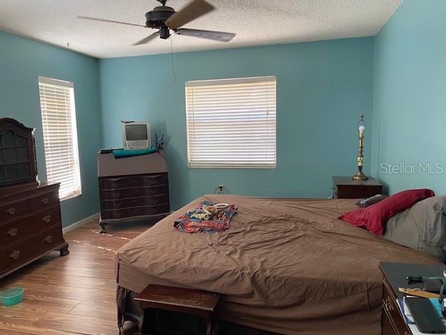 2058 Dodge Street Clearwater, FL 33760 - Photo 22 of 25 a bedroom with a bed and a television
