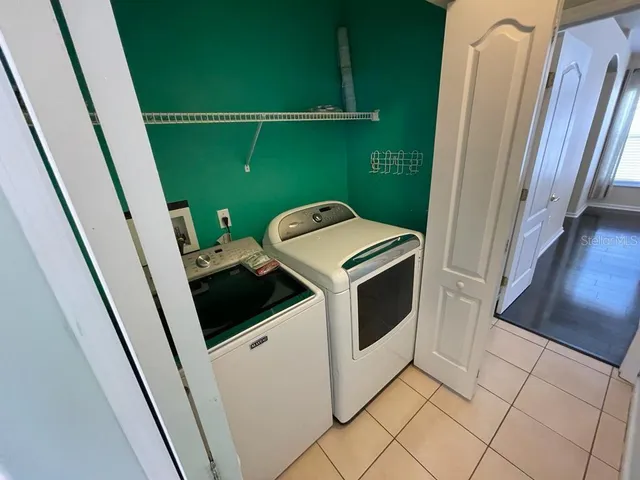 a utility room with dryer and washer
