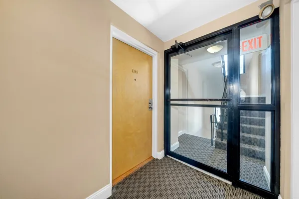 a bathroom with a glass shower door