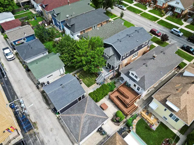 an aerial view of residential house with outdoor space and parking