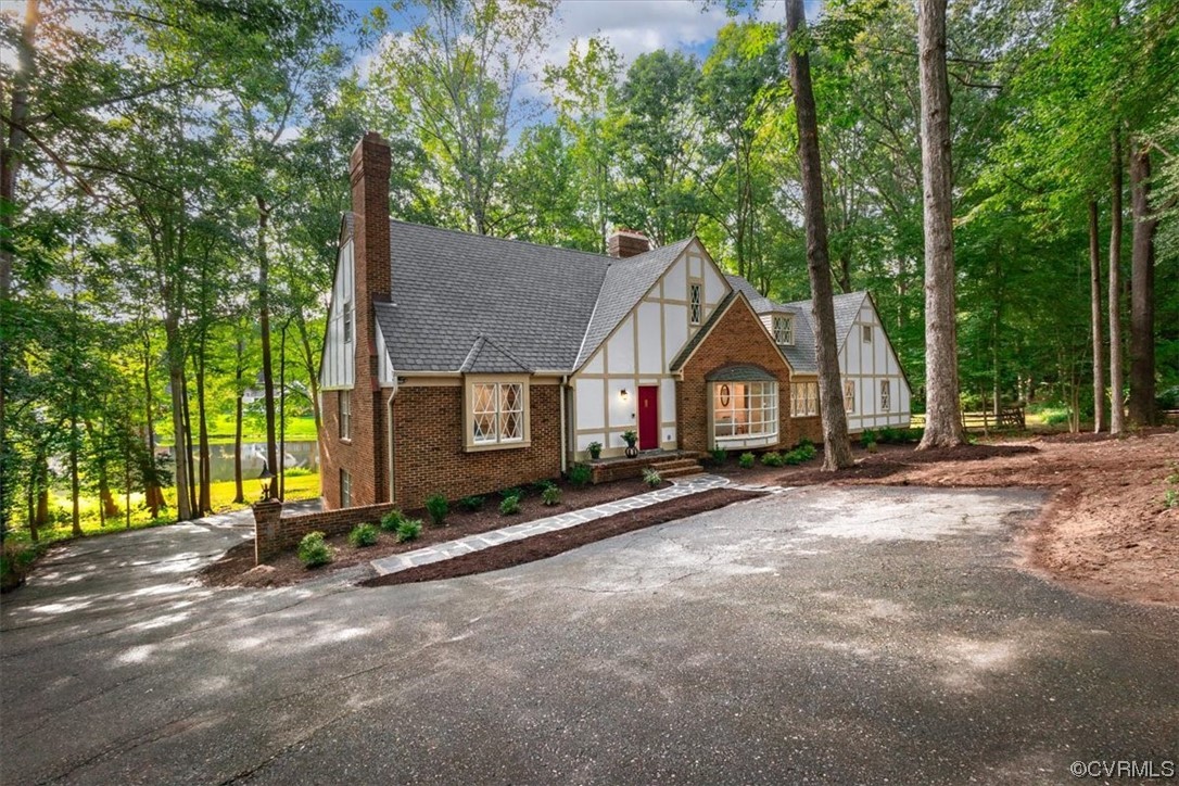 9349 Cardiff Loop Road North Chesterfield, VA 23236 - Photo 1 of 50 a view of a house with a yard and tree s