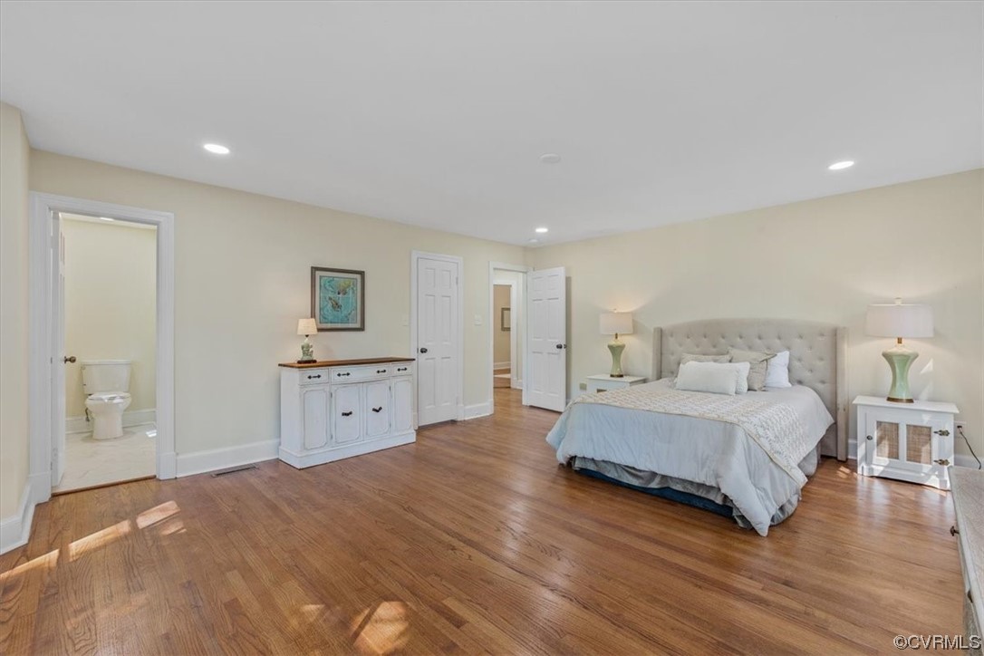 9349 Cardiff Loop Road North Chesterfield, VA 23236 - Photo 15 of 50 a spacious bedroom with a bed and a couch