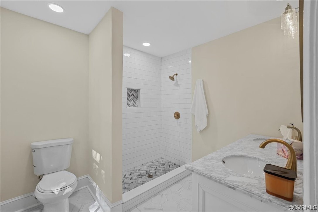 9349 Cardiff Loop Road North Chesterfield, VA 23236 - Photo 16 of 50 a bathroom with a granite countertop sink a toilet and shower