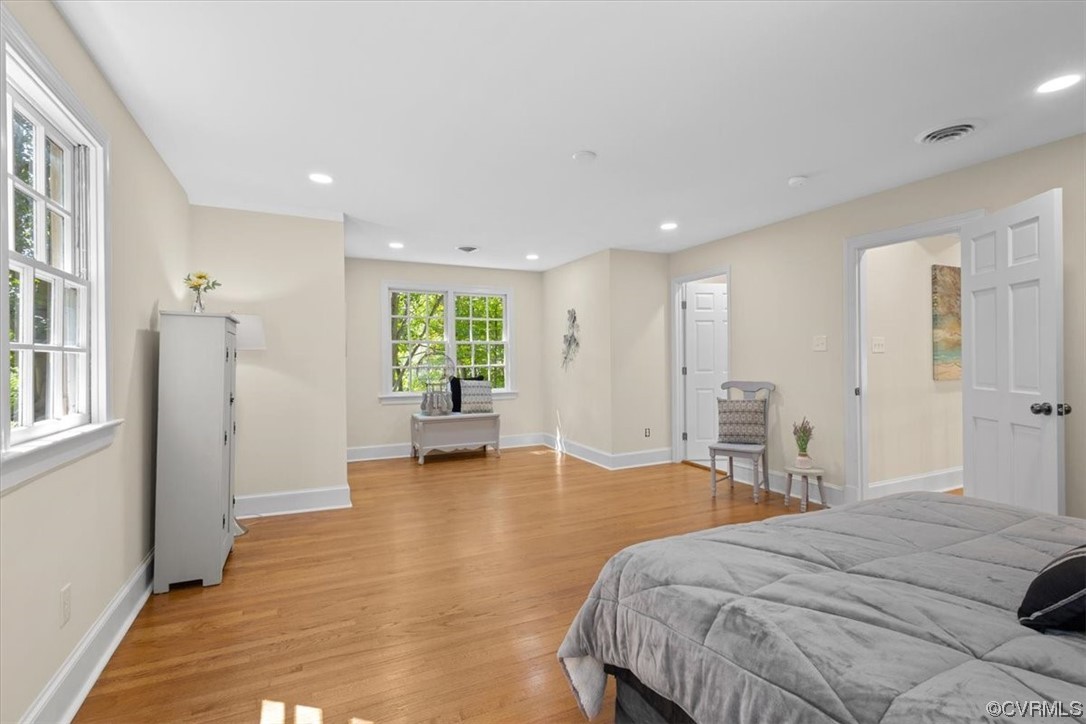 9349 Cardiff Loop Road North Chesterfield, VA 23236 - Photo 27 of 50 a spacious bedroom with a bed and a table in it