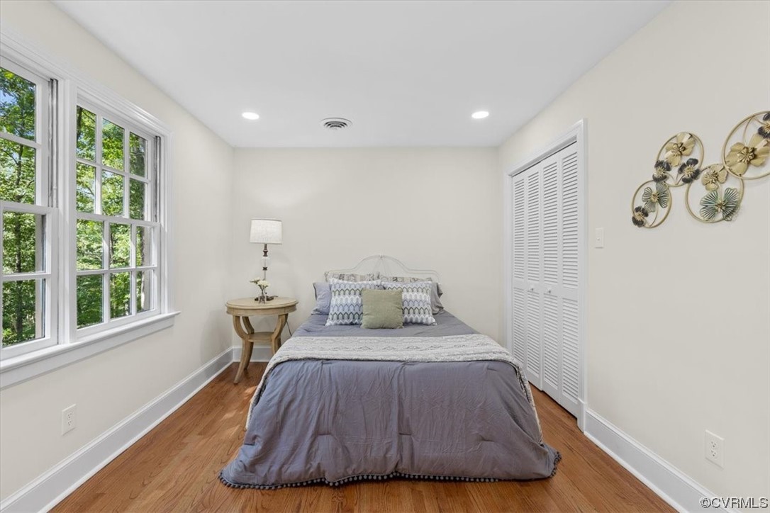 9349 Cardiff Loop Road North Chesterfield, VA 23236 - Photo 31 of 50 a bedroom with a bed and wooden floor