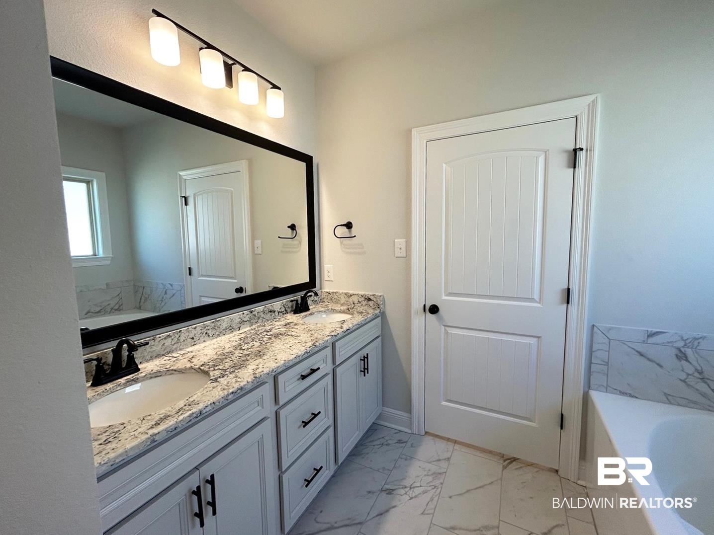 880 Sumter Loop Foley, AL 36535 - Photo 8 of 14 Bathroom featuring vanity and a tub to relax in