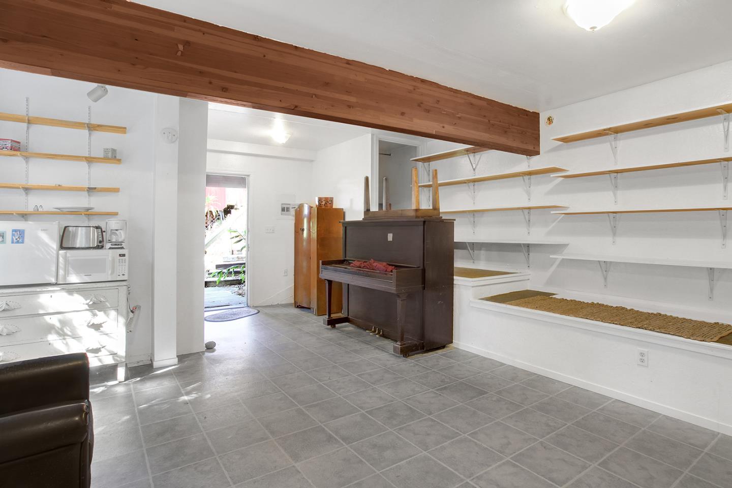 176 Roquena Drive La Honda, CA 94020 - Photo 14 of 21 a living room with furniture and a kitchen area