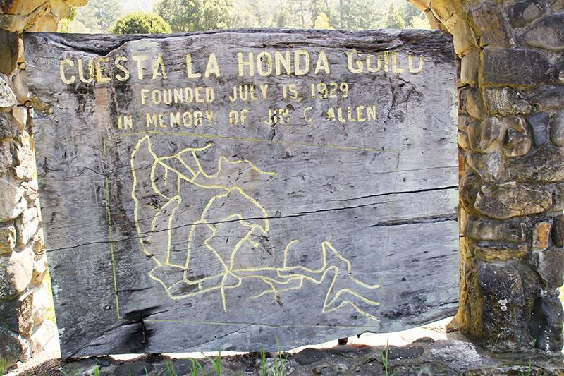 176 Roquena Drive La Honda, CA 94020 - Photo 17 of 21 a sign on the side of a brick building