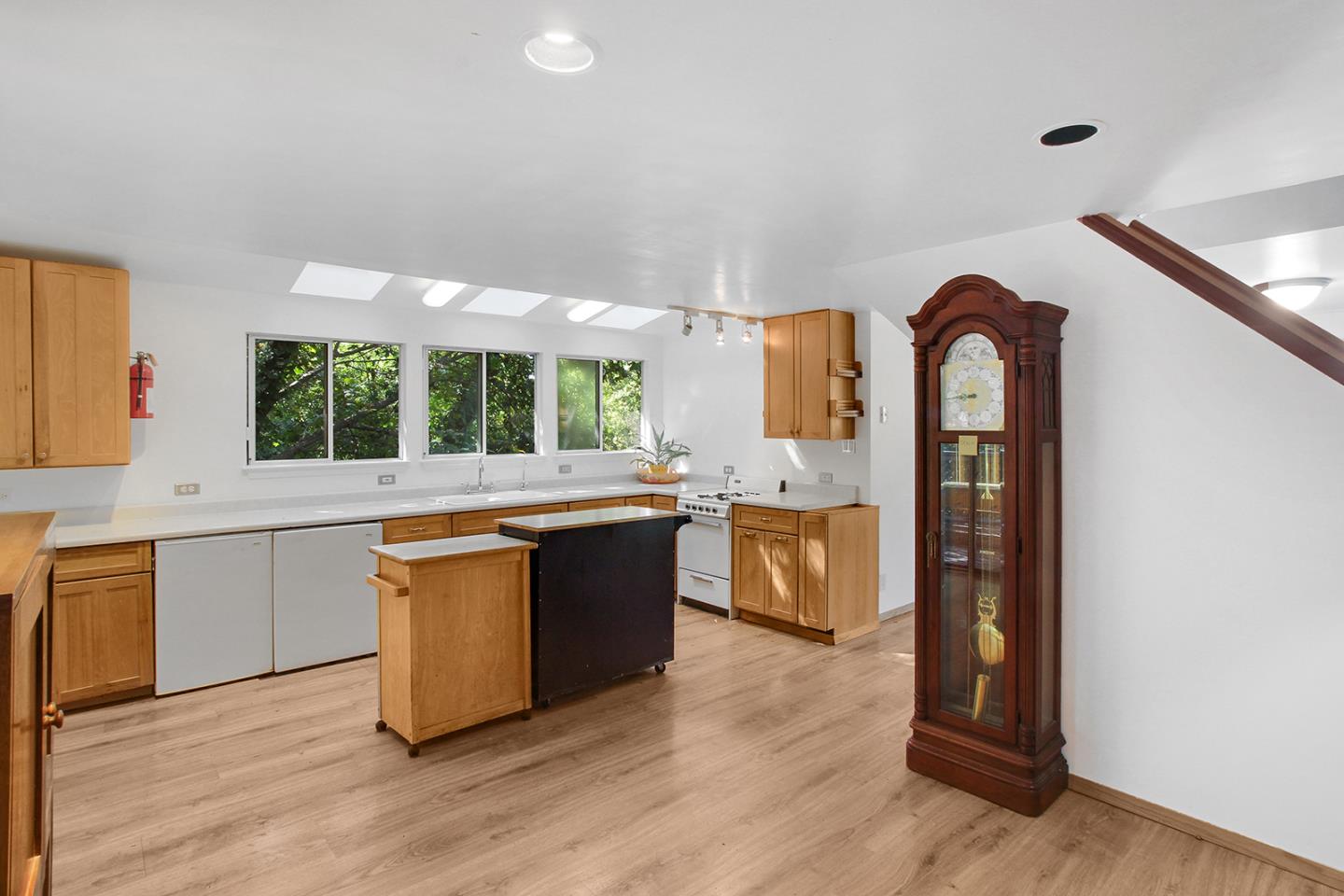 176 Roquena Drive La Honda, CA 94020 - Photo 5 of 21 a kitchen with granite countertop a stove a sink and a refrigerator