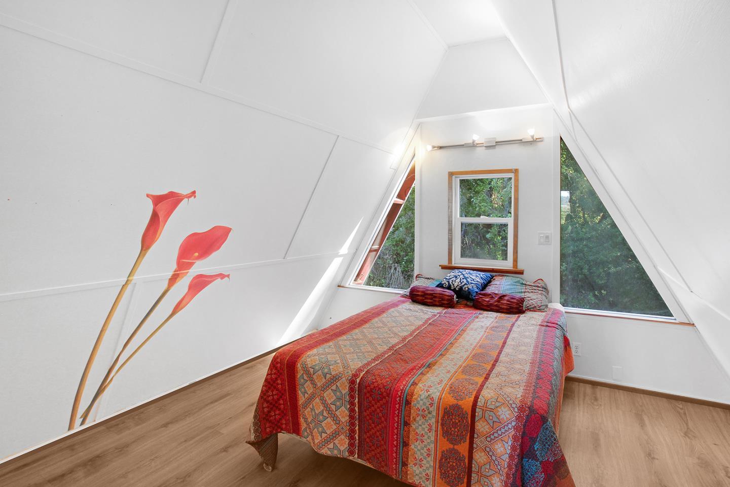 176 Roquena Drive La Honda, CA 94020 - Photo 8 of 21 a bedroom with a bed and a window