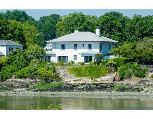 701 Steamboat Road Greenwich, CT 06830 - Photo 2 of 19 a front view of a house with a yard