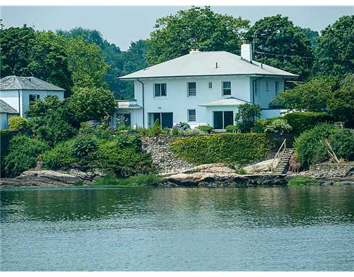 701 Steamboat Road Greenwich, CT 06830 - Photo 4 of 19 a white house with a yard and a lake view