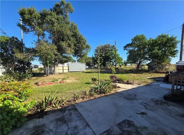 a view of swimming pool with a garden