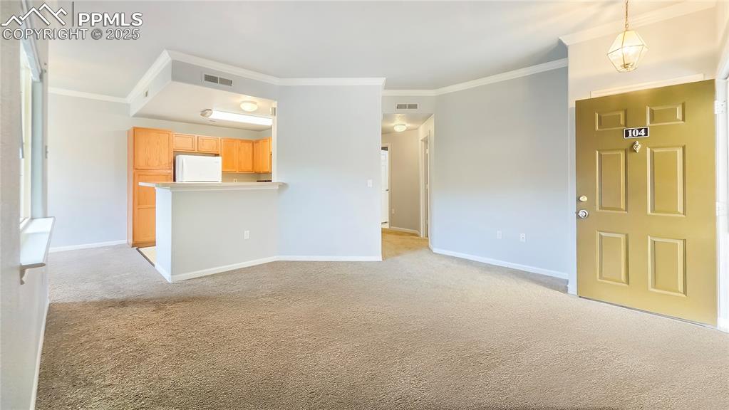 3731 Riviera Grove, Unit 104 Colorado Springs, CO 80922 - Photo 3 of 15 a view of empty room with a fireplace