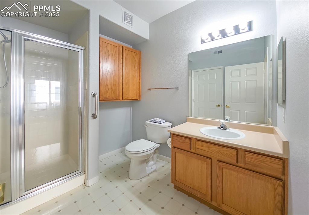 3731 Riviera Grove, Unit 104 Colorado Springs, CO 80922 - Photo 7 of 15 a bathroom with a sink toilet and shower