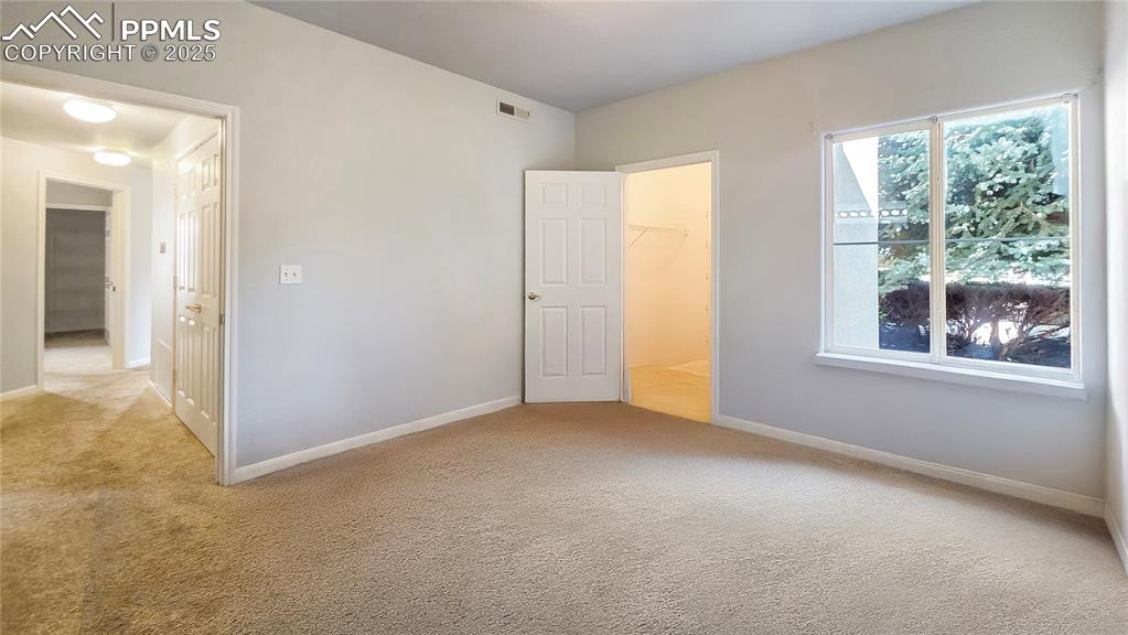 3731 Riviera Grove, Unit 104 Colorado Springs, CO 80922 - Photo 8 of 15 an empty room that has a window
