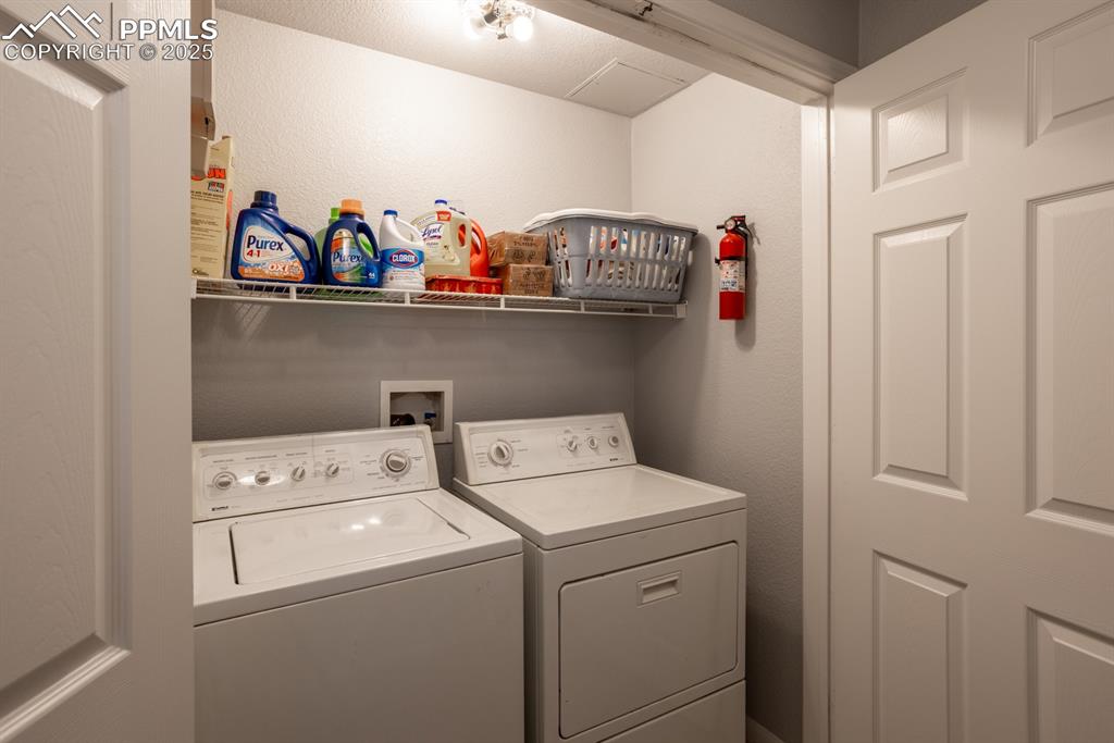 3731 Riviera Grove, Unit 104 Colorado Springs, CO 80922 - Photo 10 of 15 a utility room with dryer and washer