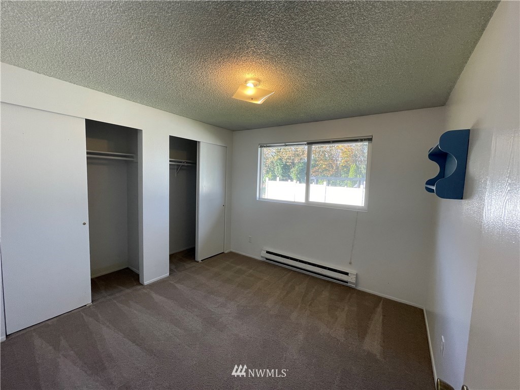 18404 Albany Street Southwest, Unit A & D Rochester, WA 98579 - Photo 11 of 19 an empty room with windows