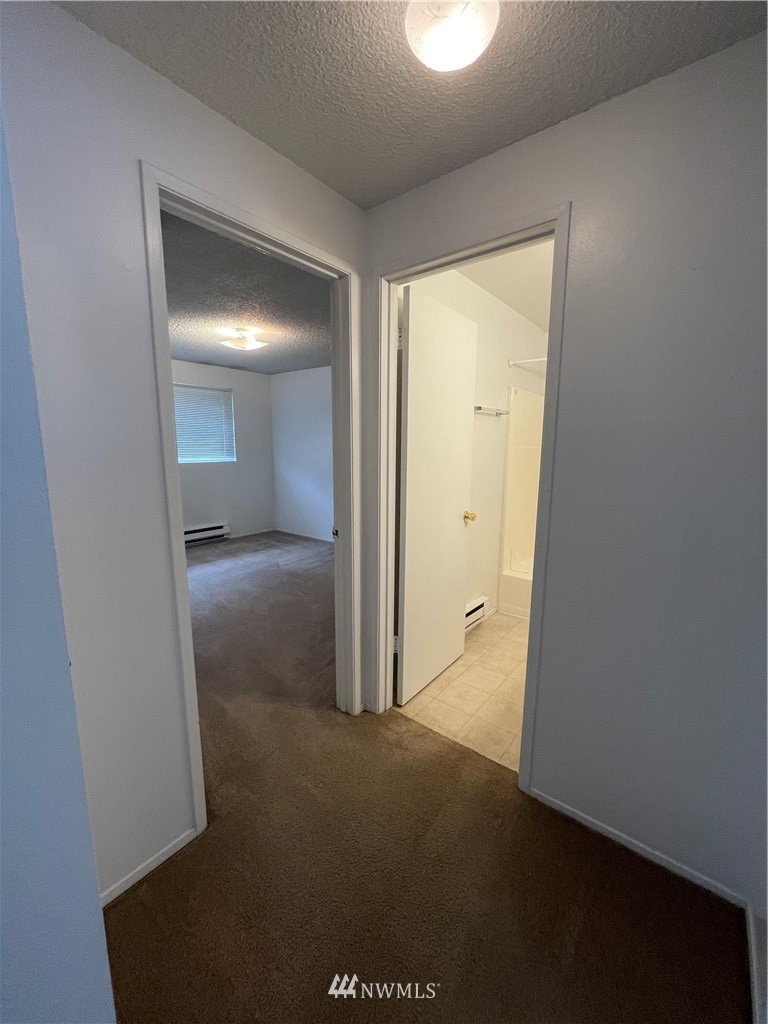 18404 Albany Street Southwest, Unit A & D Rochester, WA 98579 - Photo 12 of 19 an empty room with windows