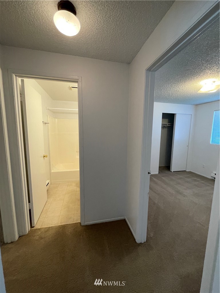 18404 Albany Street Southwest, Unit A & D Rochester, WA 98579 - Photo 13 of 19 an empty room with windows